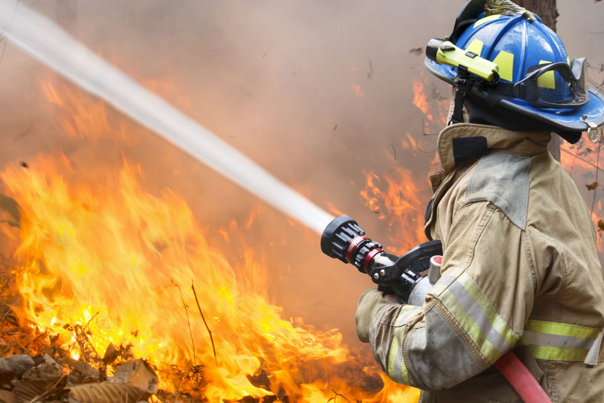 Firefighters fighting fire and explosions.